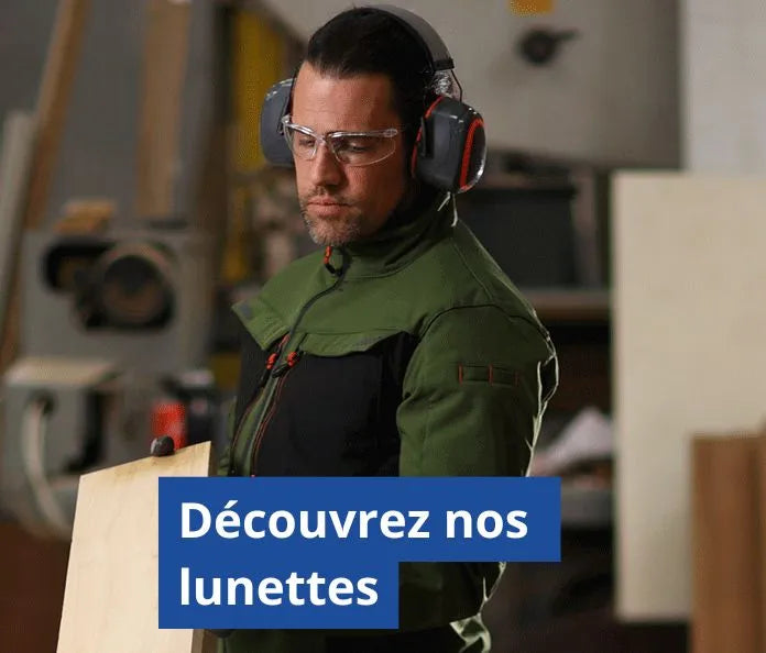 Homme portant des équipement de protection individuelle tel un casque et des lunettes de protection